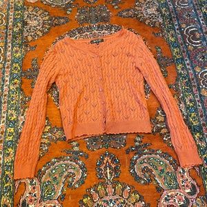 Orange button down knit cardigan sweater